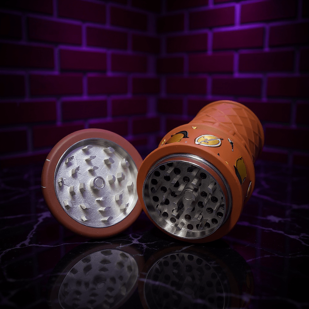 chocolate herb grinder with metal components on a reflective surface