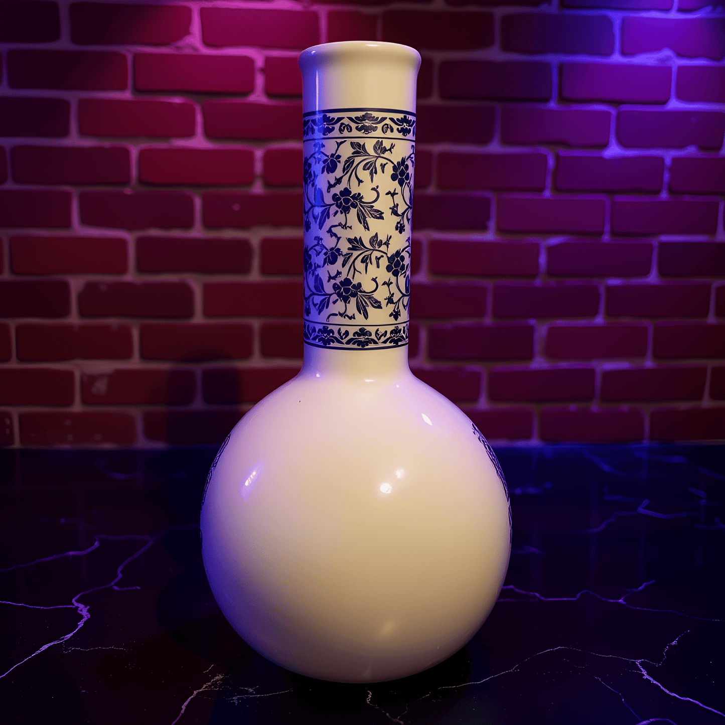 Blue Blossom Ceramic Bong – Vintage BongWhite Ceramic bong with blue floral patterns against a brick wall