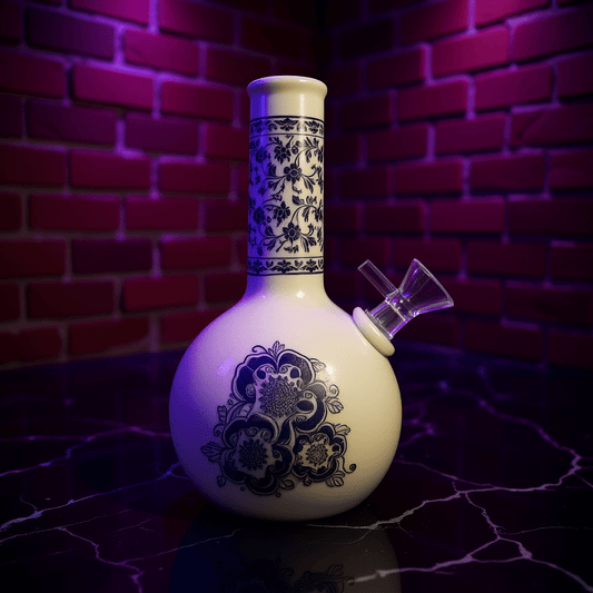 Blue Blossom Ceramic Bong – Vintage BongDecorative ceramic bong with blue floral patterns against a brick wall background