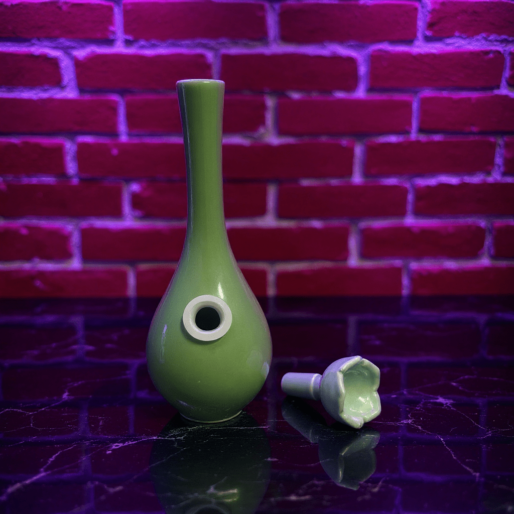 Classic Green Celadon Porcelain Bong with Slim Neck Designslim neck classic green celadon porcelain bong and ceramic bowl are placed on a marble surface.