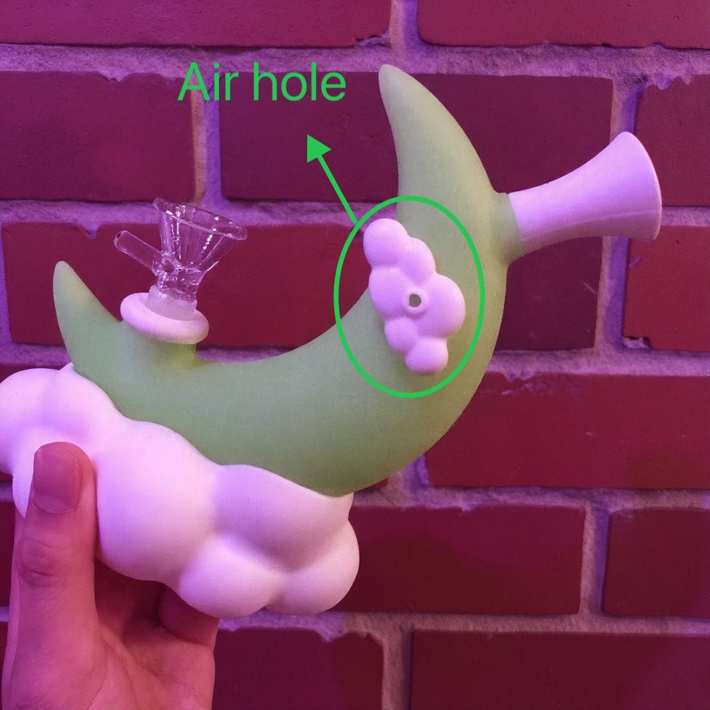 ☁️ CloudBreaker Water Pipe - Dreamy Silicone BongCloud Moon Silicone Bong with an air hole highlighted against a brick wall background