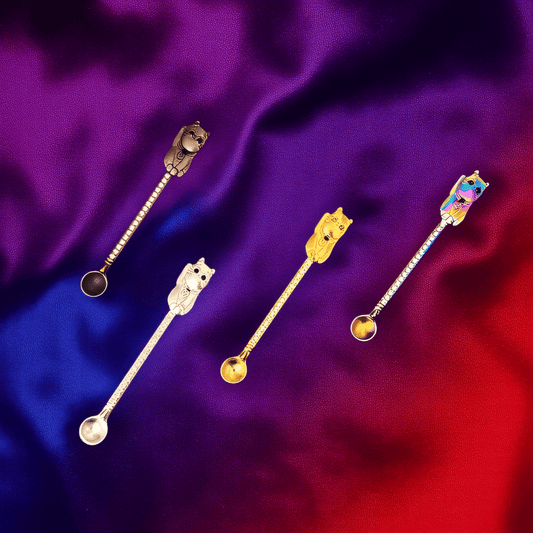 Cosmic Cat Duo Spoon SetClose - up of four cat herb spoons in gold, silver, rainbow, and black, perfectly aligned