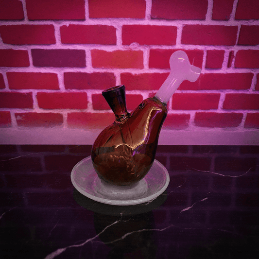 Drumstick Glass Bong – Mini Turkey Leg Water Pipe - Glass pipe with a heart - shaped bowl on a reflective surface