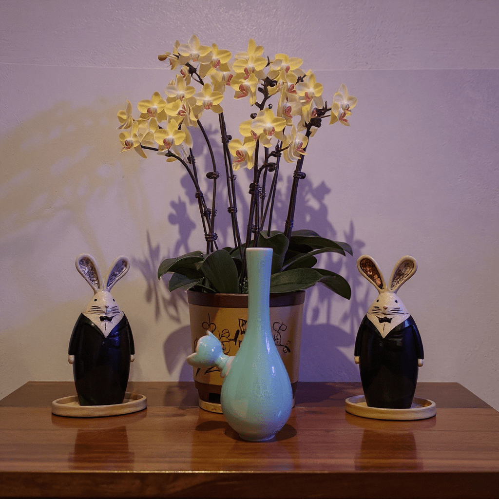 Light Green Slim Neck Celadon Porcelain Bonga slim neck porcelain bong with ceramic bowl is placed on a wooden surface.