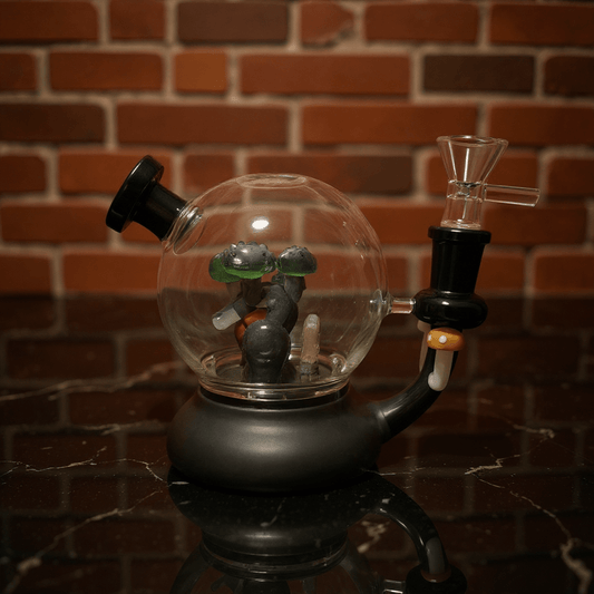 Mushroom Globe Bong - Glass smoking bong with a small figurine inside against a brick wall background