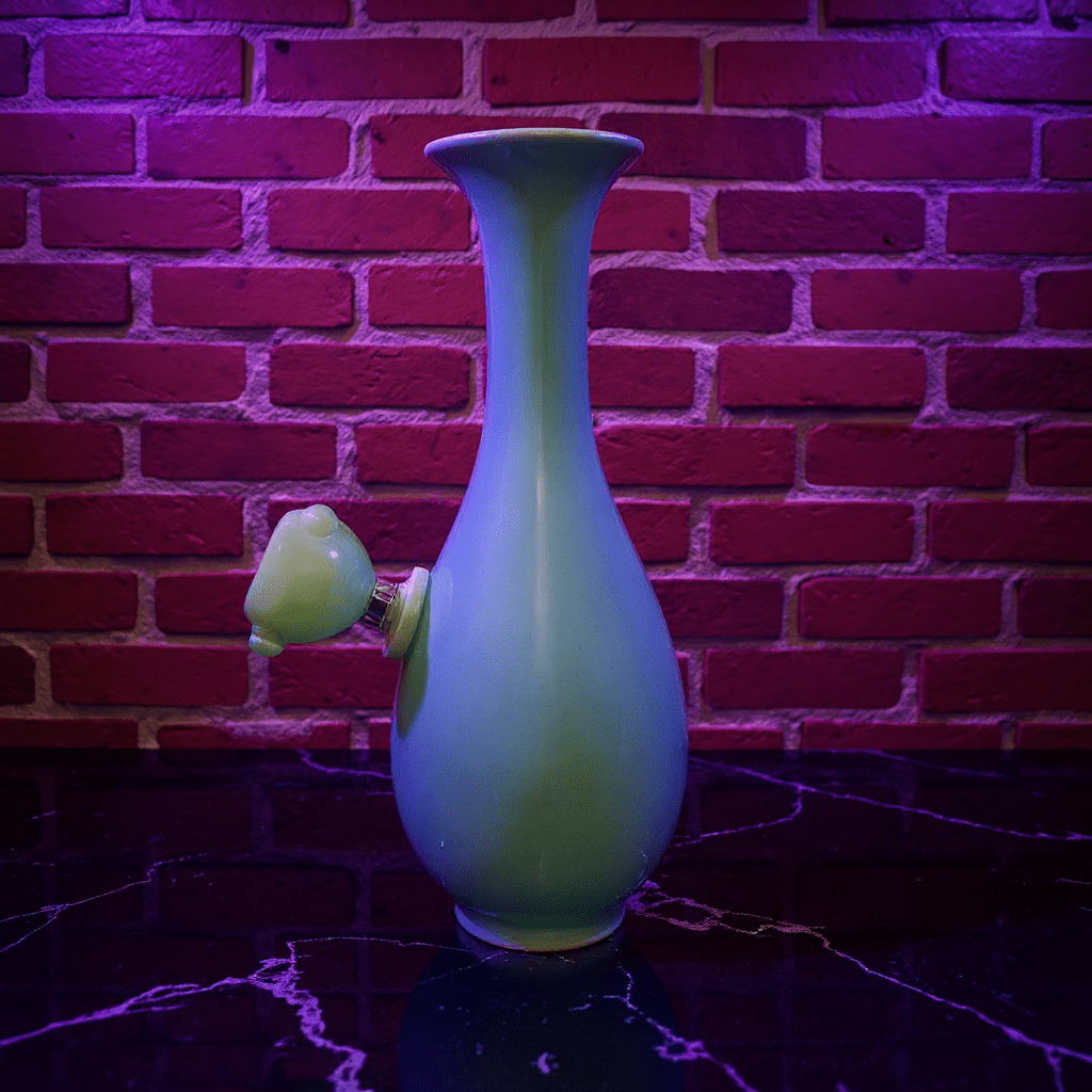 Pale Blue Flared Top Celadon Porcelain BongPale Blue Flared Top Celadon Porcelain Bong with glass bowl is placed on a marble surface.