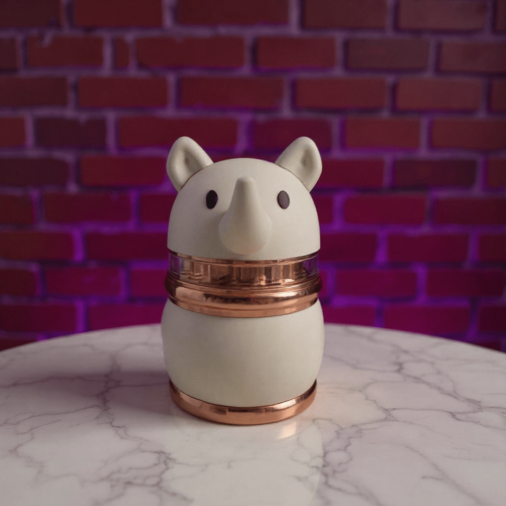 Rhino Buddy Herb Grinder – 4 - Layer Cute Spice & Herb Crusher4 - Layer Cute Spice & Herb CrusherCute rhino herb grinder with rose gold center ring and ivory body, centered