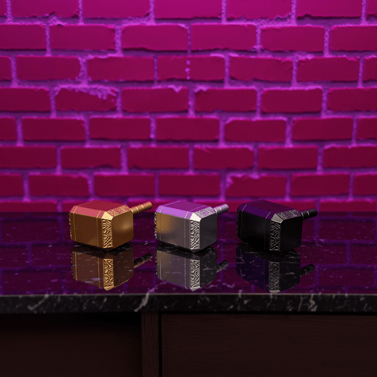 Three metallic hammers grinder on a reflective surface