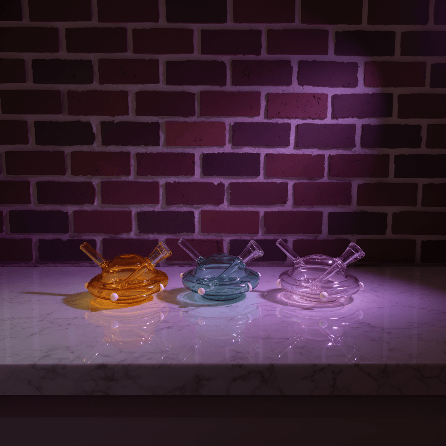 UFO Mini Glass Bong – Water Pipe in 3 ColorsThree colorful glass water pipe on a marble surface with a brick wall background