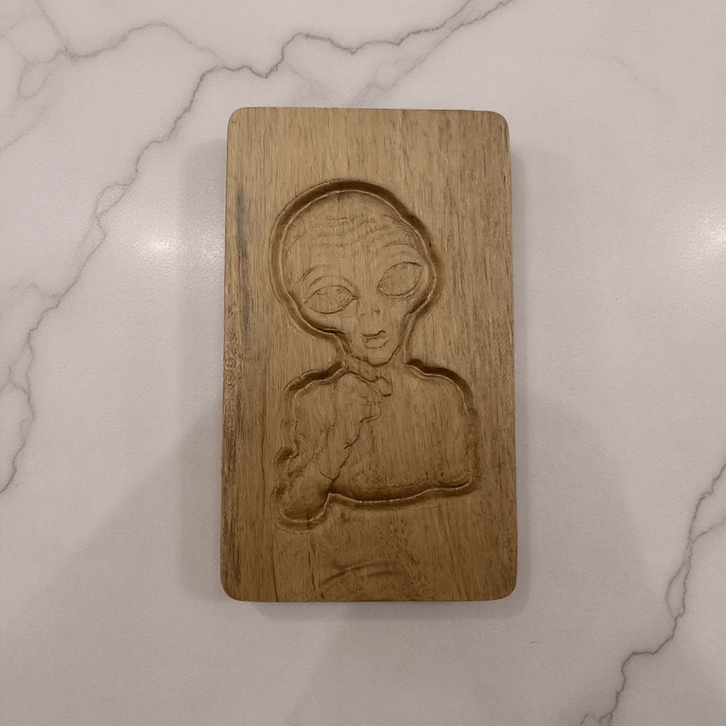 Light wood alien stash box with quirky engraved alien face,