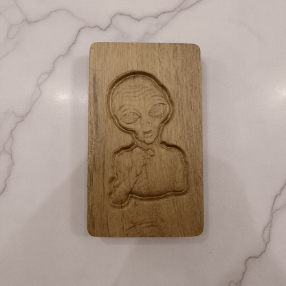 Alien Wooden Tobacco Box – Hand - Carved Secret Herb KeeperLight wood alien stash box with quirky engraved alien face,
