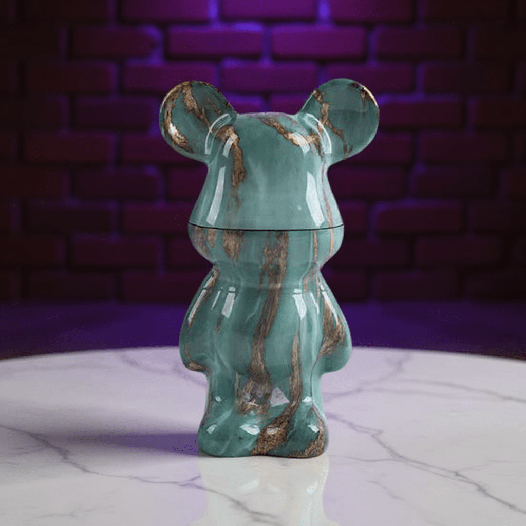 Bear Sculpture Herb Grinder - Green marble - patterned herb grinder with a purple brick wall background