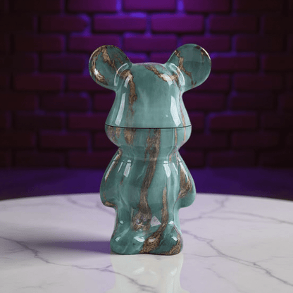 Bear Sculpture Herb Grinder - Green marble - patterned herb grinder with a purple brick wall background