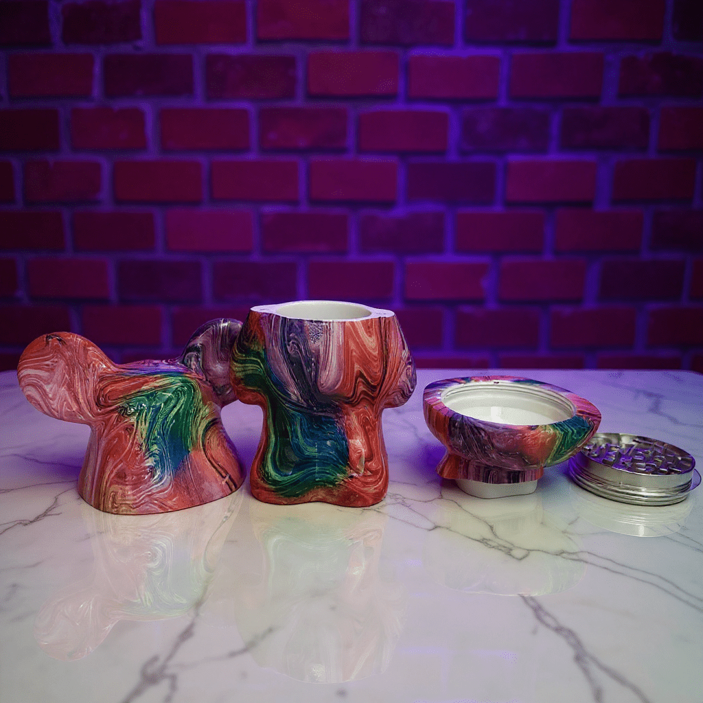 Bear Sculpture Herb GrinderColorful grinder set on a marble surface with a brick wall background