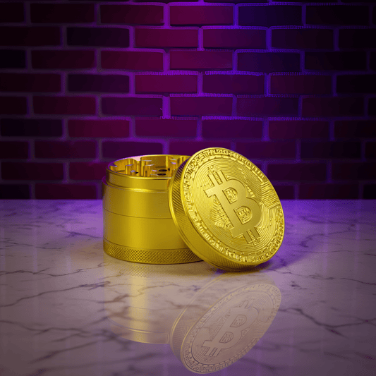 Bitcoin Herb Grinder – Gold Aluminum 4 - Piece Grinder - Gold Bitcoin - shaped grinder on a reflective surface
