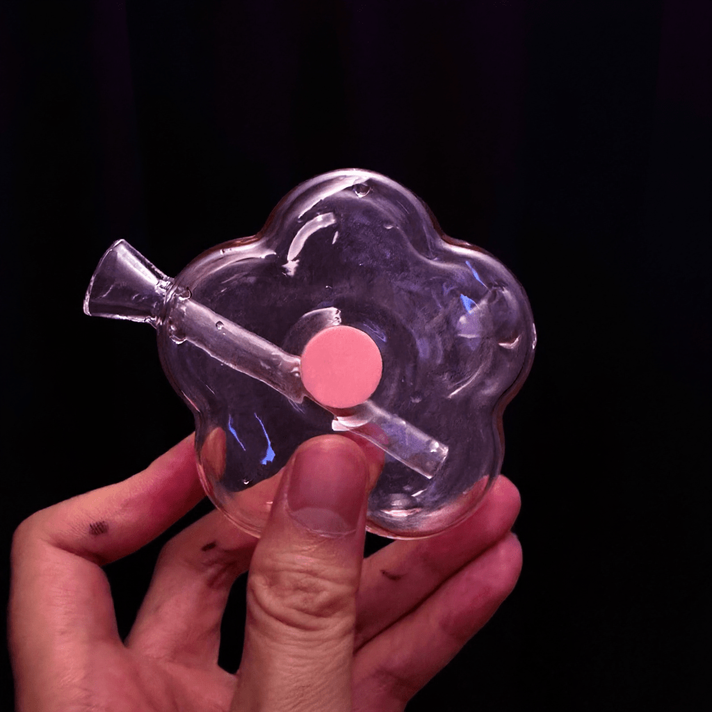 Bloom Puff Glass Bong - Cute bong for girlsBloom Puff Glass Water Pipe. Backside view of a flower - shaped glass hand pipe with internal glass stem visible