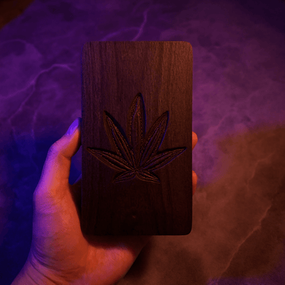 Cannabis Leaf Wooden Tobacco Box – Hand - Carved Herb Stash CaseHand holding dark walnut wood stash box engraved