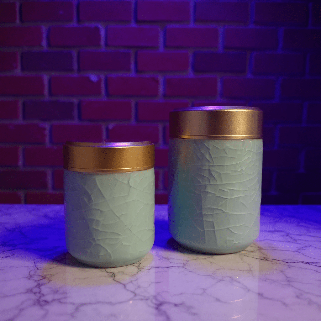 Celadon Porcelain Stash Jar – Light Green Ceramic Herb Storage ContainerTwo light green celadon porcelain stash jars with gold lids on a marble surface