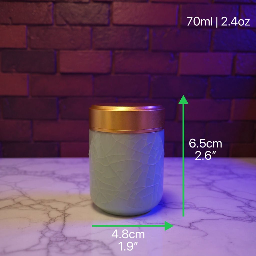 Celadon Porcelain Stash Jar – Light Green Ceramic Herb Storage Containerlight green stash jar with gold lid on a marble surface