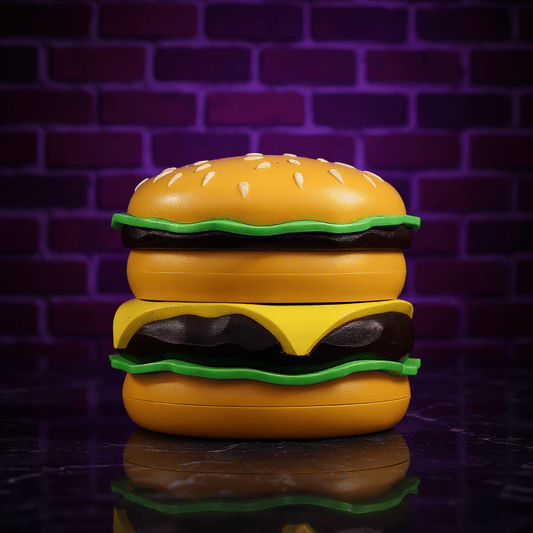 Cheese Burger Herb GrinderHamburger - shaped tobacco herb grinder with a brick wall background