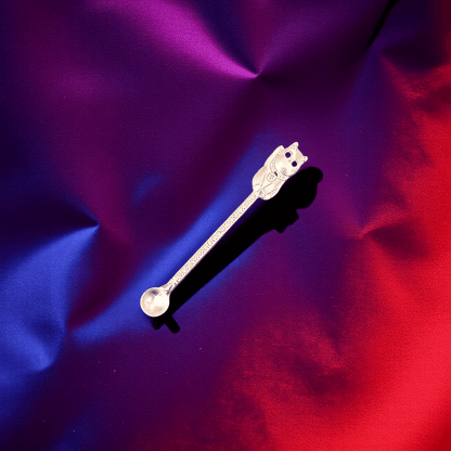 Cosmic Cat Duo Spoon SetSleek silver cat scoop with minimalist etching, resting on luxurious violet - blue silk.
