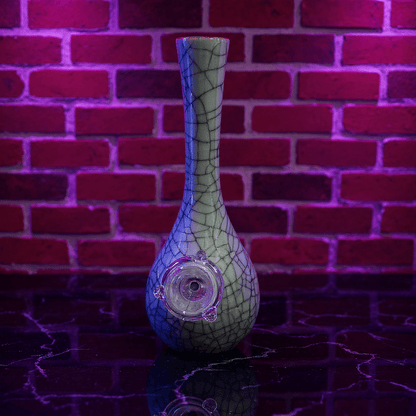 Crackle Glaze Slim Neck Celadon Porcelain Bonga slim neck crackle celadon porcelain bong with glass bowl is placed on a surface.
