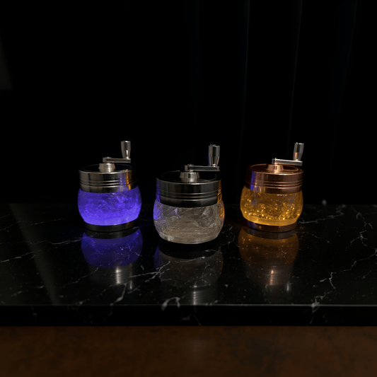 Crystal Hand Crank Herb GrinderCrystal Hand Crank GrinderRomantic purple - lit room featuring a trio of designer hand - crank grinders.