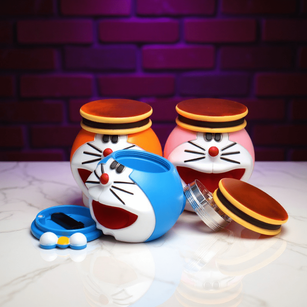 Cute Cat Crank GrinderThree Doraemon - style grinders with one opened to show internal storage and grinding tools