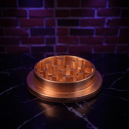Cute Ceramic Cat Herb Grinder – Spice CrusherBronze - colored metal grinder on a dark surface