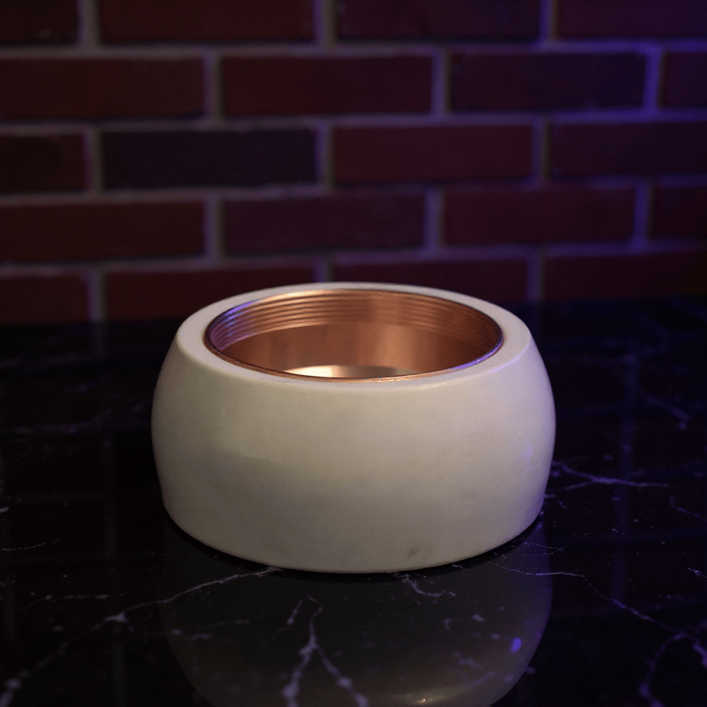 Cute Pig Ceramic Herb Grinder – Spice Crusher - White ceramic grinder neck with bronze interior against a dark background