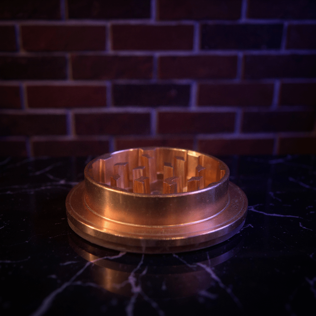 Cute Pig Ceramic Herb Grinder – Spice Crusher - Bronze colored metal grinder on a dark surface with a brick wall