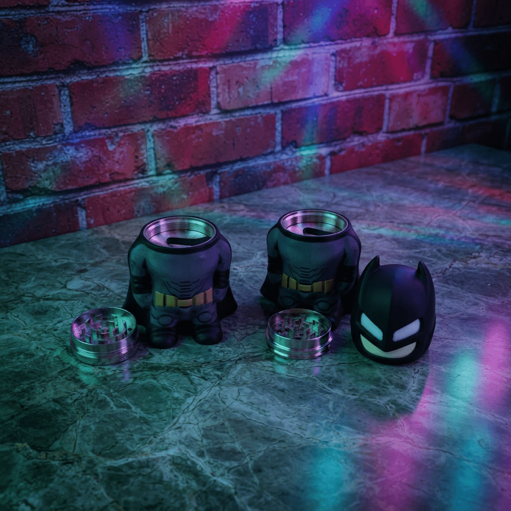 Dark Hero Character Herb Grinder – Superhero Style Metal GrinderBatman shape grinder shape on a marble table