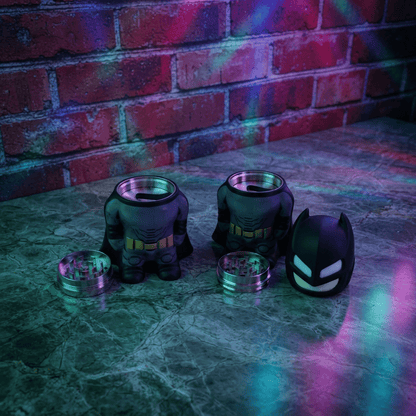 Dark Hero Character Herb Grinder – Superhero Style Metal GrinderBatman shape grinder shape on a marble table