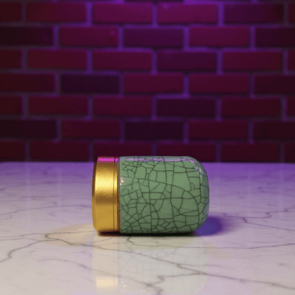 Deep Green Celadon Porcelain Stash Jar – Large & Small SizesCeladon porcelain stash jar with cracked glaze design on a marble surface