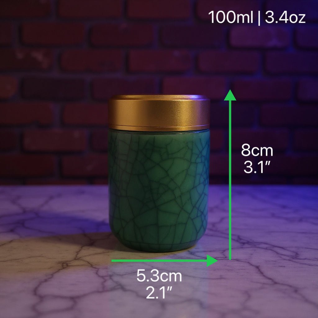 Deep Green Celadon Porcelain Stash Jar – Large & Small SizesGreen celadon porcelain stash jar with gold lid on a cracked surface
