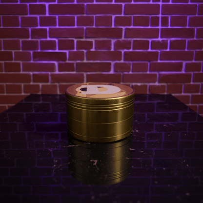 Doge Meme Herb Grinder - Gold - colored metal grinder on a reflective surface with a brick wall background