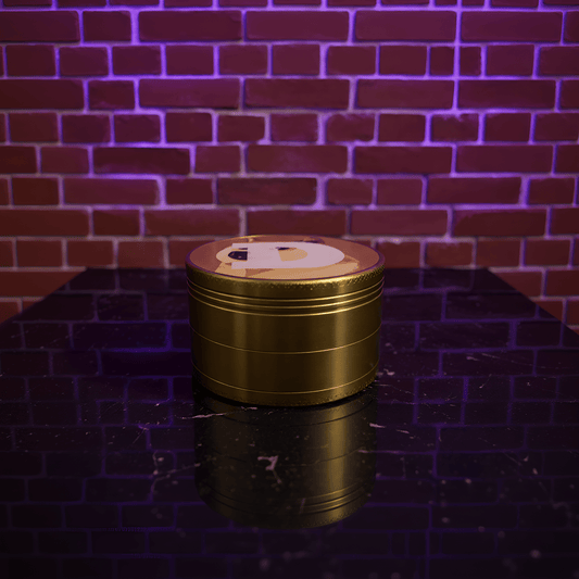 Doge Meme Herb Grinder - Gold - colored metal grinder on a reflective surface with a brick wall background