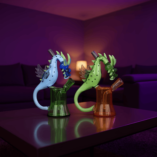 Dragon Rider BongTwo dragon -shaped glass bong, one green and one orange, side by side on display under soft ambient lighting