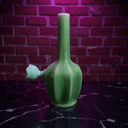 Glossy Green Flat - Sided Celadon Porcelain BongGlossy Green Flat - Sided Celadon Porcelain Bong with ceramic bowl is placed on a marble surface.