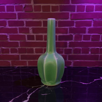 Glossy Green Flat - Sided Celadon Porcelain BongGreen bong on a reflective surface with a brick wall background