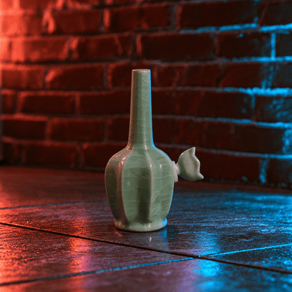 Green Dragon Scale Celadon Flat-Sided Porcelain BongIce - Crack Green Celadon Flat - Sided Porcelain Bong with ceramic bowl is placed on a wooden surface.
