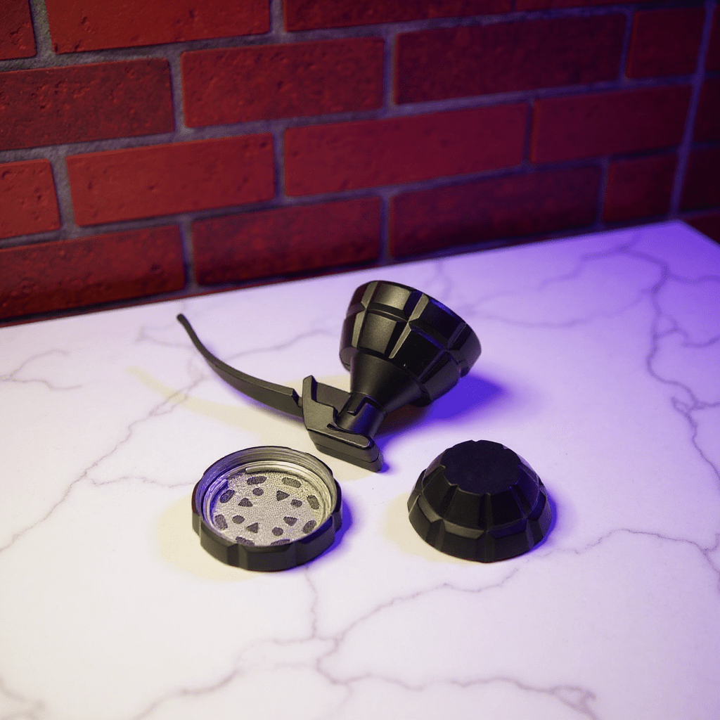 Grenade Herb Grinder – Camouflage Designpieces of grenade herb grinder on a white surface with a brick wall background