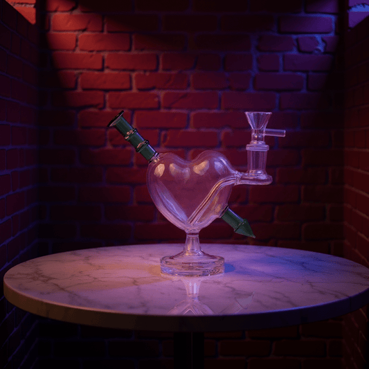 Heartpiercer Water Pipe – Mint Arrow EditionHeart - shaped glass bong on a marble table with a brick wall background