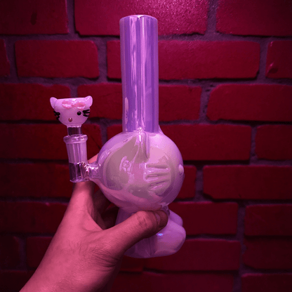 Hello Glow Mini Bong – Cute Style with Crystal Glass. Hello Glow Water Pipe. Hand holding a cute white Hello Kitty glass bong