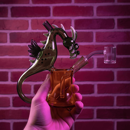 House of Dragon Glass Bong – RPG & Anime Style Water PipeGlass dragon - shaped pipe held by a hand against a brick wall background