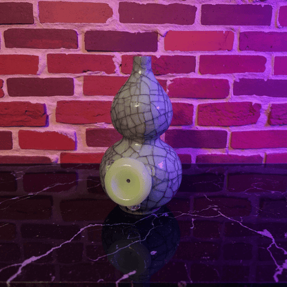 Ice - Crack Blue Celadon Gourd Porcelain BongDecorative ceramic bong with cracked pattern on a reflective surface