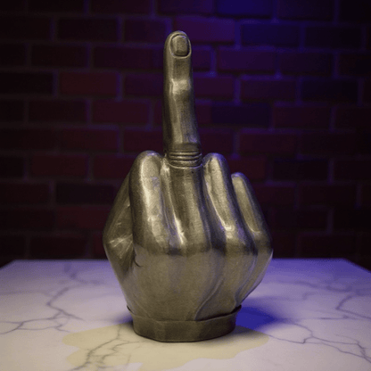 Middle Finger Grinder & Pipe Combo – Heavy Duty 2 - in - 1 SystemMetallic hand grinder with middle finger pointing upwards against a brick wall.