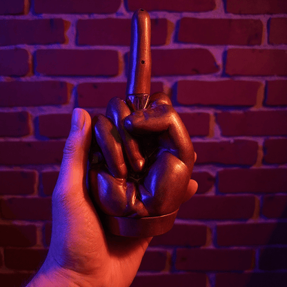 Middle Finger Grinder & Pipe Combo – Heavy Duty 2 - in - 1 SystemHand holding a middle finger grinder against a brick wall.