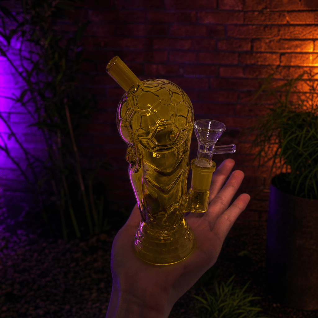 Mini 2026 American World Cup Trophy Glass Bong – Soccer & FootballHand holding a glass bong with a straw against a dark background