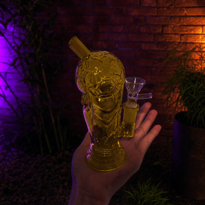 Mini 2026 American World Cup Trophy Glass Bong – Soccer & FootballHand holding a glass bong with a straw against a dark background